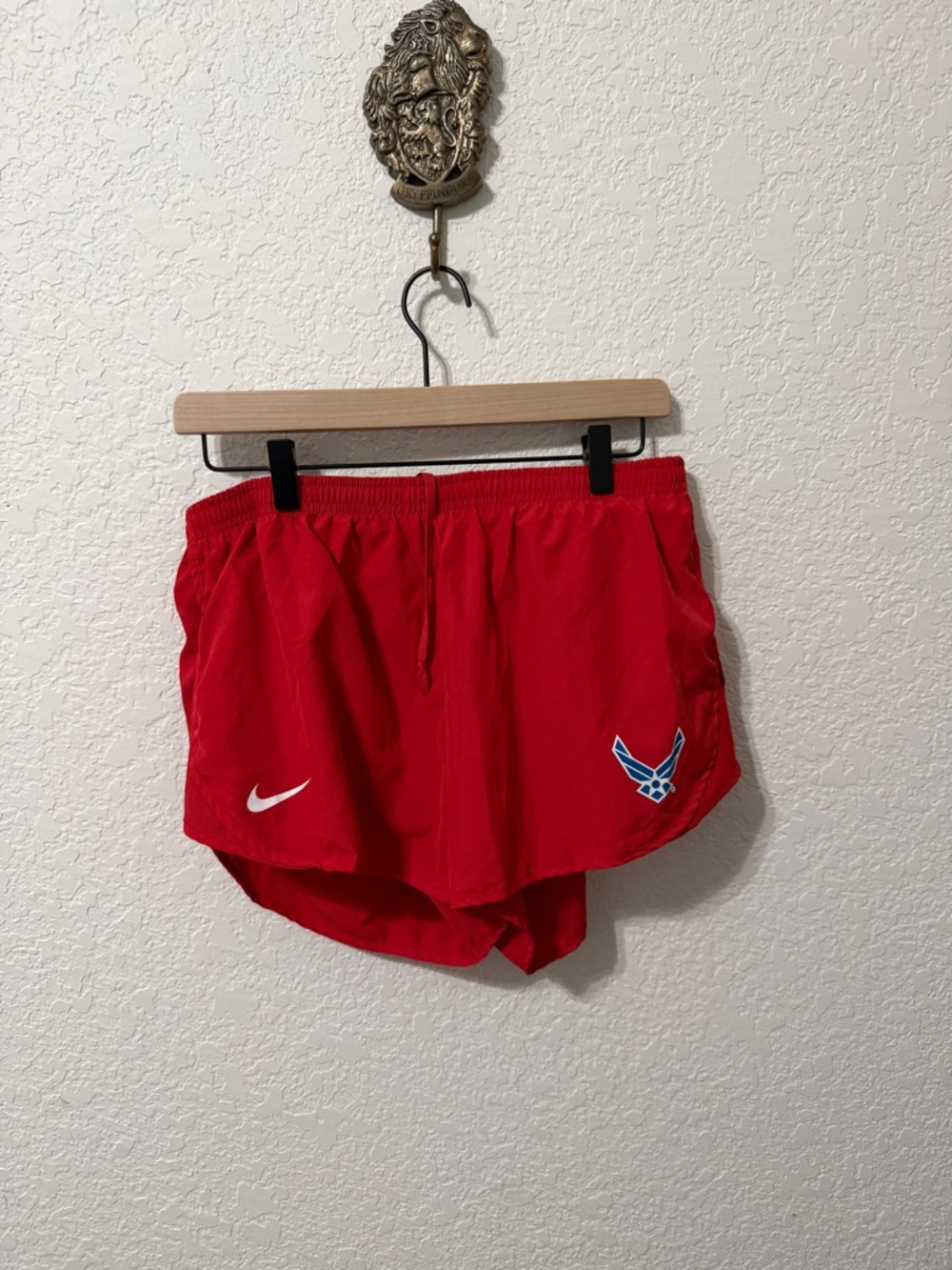 Nike Women's Red Athletic Shorts with Blue Air Force Emblem